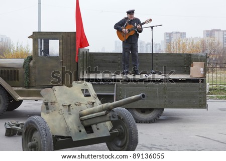 SAINT-PETERSBURG, RUSSIA – NOVEMBER 4: Military performance in celebration of National Unity Day. Soviet soldier singing from the lorry on November 4, 2011 in Saint-Petersburg, Russia.