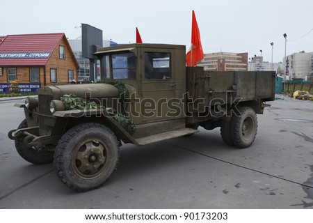 SAINT-PETERSBURG, RUSSIA – NOVEMBER 4: Military performance in celebration of National Unity Day. Soviet lorry ZIS-5 with red flags on November 4, 2011 in Saint-Petersburg, Russia.