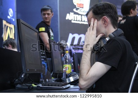 MOSCOW- OCTOBER 7:  People playing video games at the international exhibition of  the entertainment industry, Igromir on October 7, 2012 in Moscow