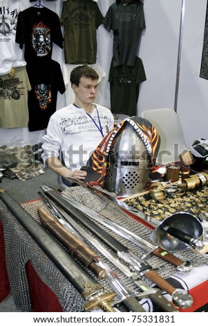 MOSCOW - APRIL 1: Ancient swords and chainmail, helmet at the Moscow specialized Exhibition  of motor cycling industry in Russia on April 1, 2011 in Moscow, Russia