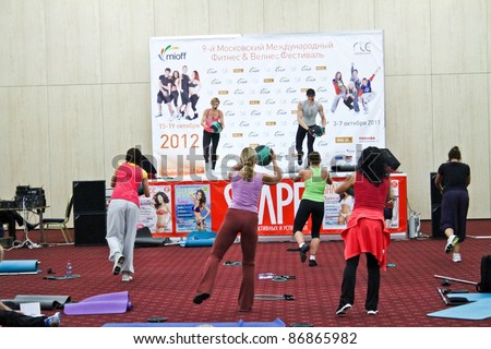 MOSCOW - OCTOBER 5: Group works out with ball at the international exhibition of the fitness and wellness industry, MIOFF on October 5, 2011 in Moscow