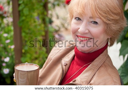 retired person enjoying a morning with a cup of coffee