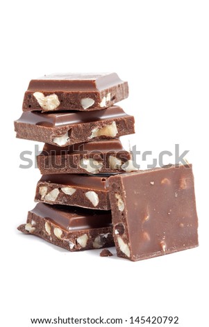 Stack of chocolate pieces on a white
