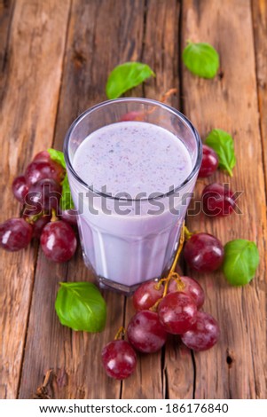 Fresh milk, Grape drink on wooden background, assorted protein cocktail with fruits.