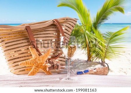 Summer concept, white wine on tropical beach.Blue sky, sea