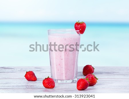 Fresh milk,strawberry drink on wooden table, assorted protein cocktails with fresh fruits.
