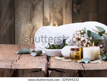 spa massage setting, nature product, oil on wooden background