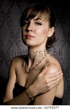 portrait of attractive woman over wallpaper background