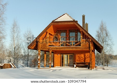House in winter season and wooden bath barrel.