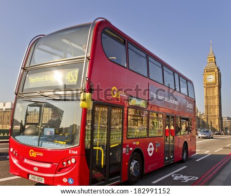 LONDON - MARCH 9: London red bus on March 9, 2014, London, UK.  London bus crossing Westminster Bridge in the United Kingdom on March 9, 2014 in London, England