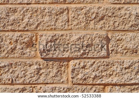 Wall from the yellow bricks close up. Background, texture
