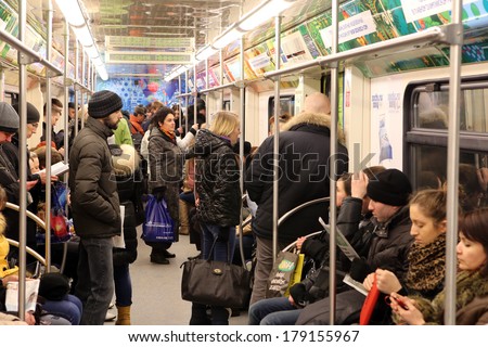 MOSCOW, RUSSIA, CIRCA 2014 - The passengers in city underground train circa 2014 in Moscow, Russia
