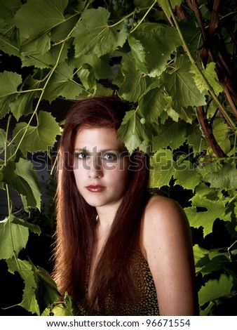 Green Goddess - Young redhead surrounded by Grape leaves