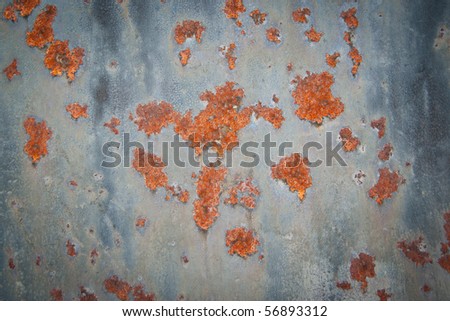 Rusted blue metal surface with scratches and spots
