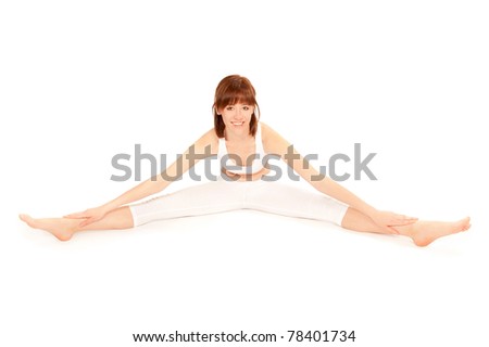 Young beautiful gymnast stretching in white sportswear, in front of white background