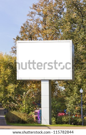 Empty big LED billboard display stand in autumn city park. Contains screen patch