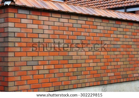 The red brick wall persprective protects a private property and real estate concept