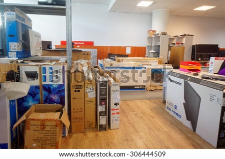 VILNIUS, LITHUANIA - AUGUST 14, 2015: Working room of  small center for repair of TVs and consumer electronics. Repair of all known brands is provided - Panasonic, Philips, Samsung and so on.