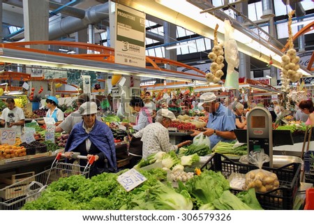 MILAN, ITALY - JUNE 24, 2015: Indoor city market of Italian vegetables and fruits. Italy is the largest producer in Europe a citrus - over 3,3 million tons per year and tomatoes over 5,5 million tons.