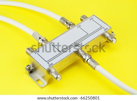 Electric switch device one input and six output on a yellow table. Mass production
