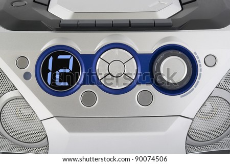 Abstract silver control panel from mass production electronic device background.  Selective focus