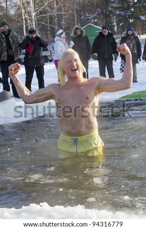 VILNIUS, LITHUANIA - FEBRUARY 4: Fans of winter swimming take a bath in some ice water on February 4, 2012 in Vilnius, Lithuania.  Minus 20  Celsius degrees. The boss of the club fans of ice water.