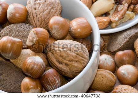 Mixture of nuts in a bowl lying on table