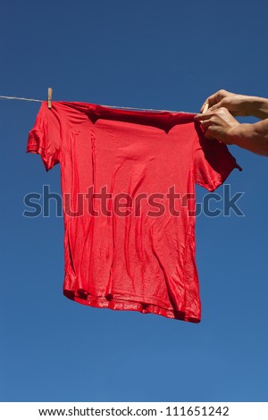 Red t-shirt on clothesline.