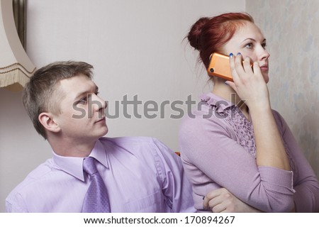 Phone and young couple.