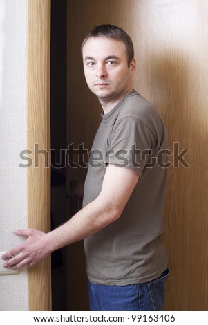 Man looking at doors.