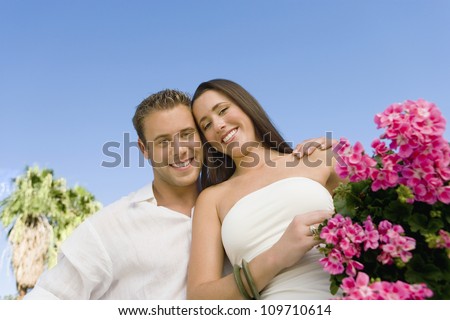 Portrait of a happy young couple at botanical garden