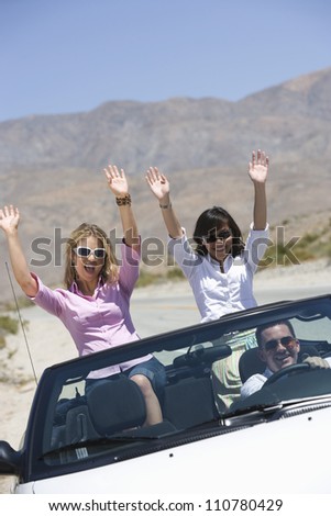 Group of friends enjoying their journey in car