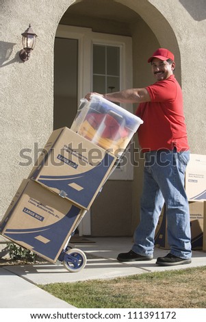 Worker delivering cardboard boxes