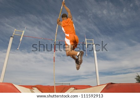 Male athlete performing a pole vault