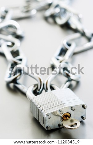 Metal padlock with key and chain