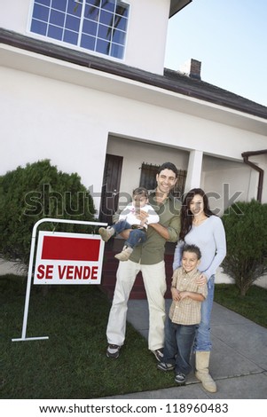 Happy Homeowners with <For Sale> Sign