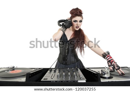 Beautiful young DJ listening to music over white background