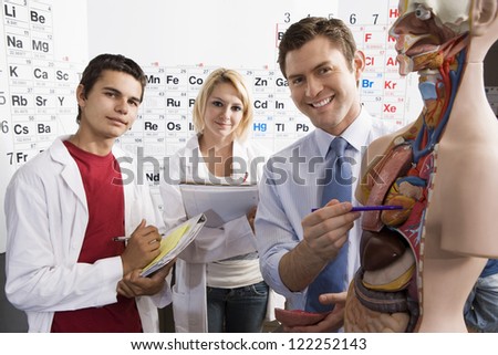 Medical students with professor in classroom