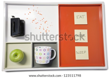 Tray with punch machine, green apple, cup and sticky note-papers