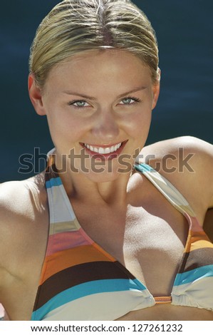 Portrait of a beautiful caucasian woman in bikini smiling