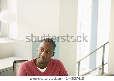 Thoughtful African American male executive in office