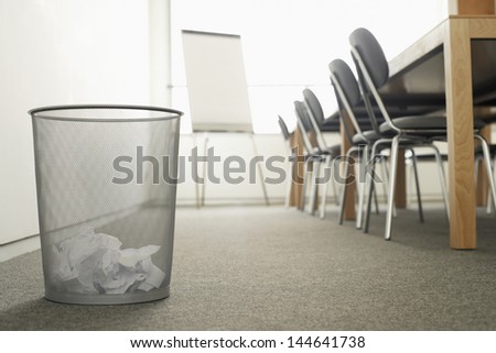 Trash Can in Empty Meeting Room