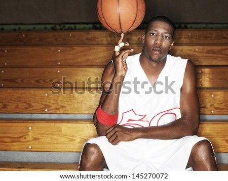 Portrait of a basketball player ball spinning ball on finger