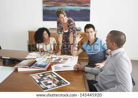 Multiethnic Businesspeople in meeting at conference table