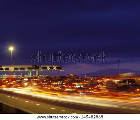 Tail backs of traffic at toll gate in California