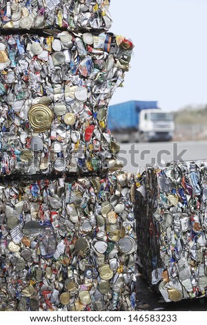 Stakes of crushed tin cans for recycling