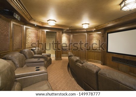 View of an entertainment room with leather seats and lit lights