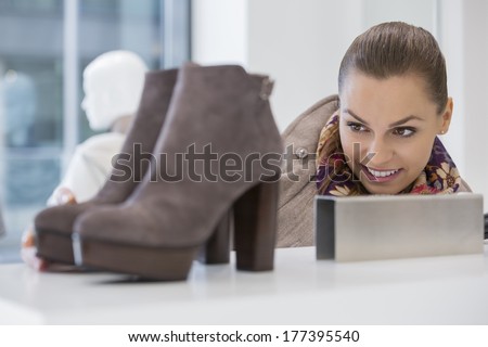 Woman admiring footwear in store