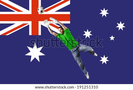 Goalkeeper saving ball in front of Australian flag