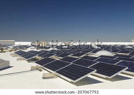 Solar Panels at solar power plant against clear sky